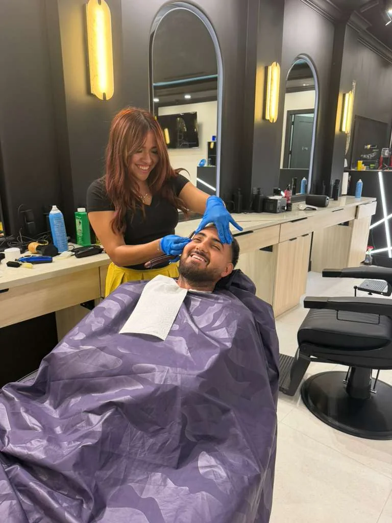 Client receiving a grooming service at Jad Cutz